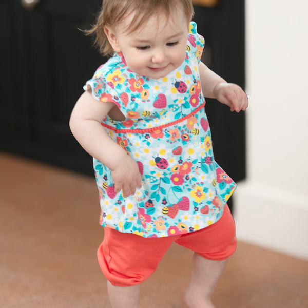 Baby wearing Piccalilly organic Tunic & shorts playset- strawberry fields