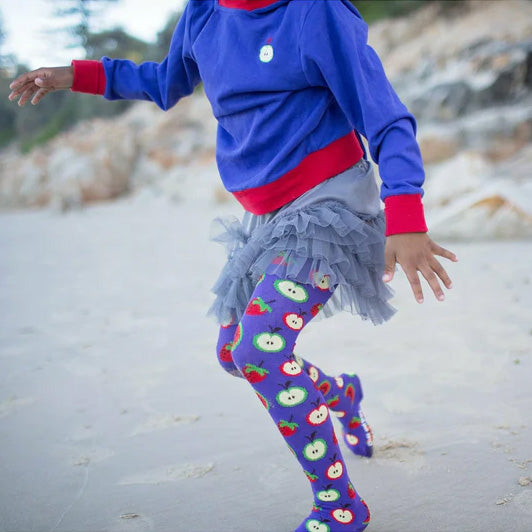 Girl wearing Slugs & Snails organic Fruit patterned tights