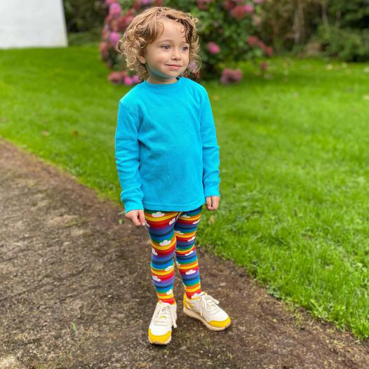 Boy wearing Slugs & Snails organic Rainbow striped tights