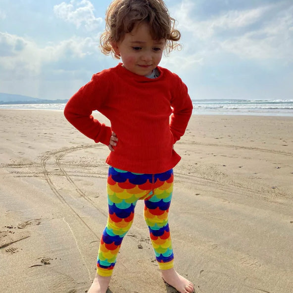 Boy wearing Slugs & Snails Organic Footless tights- rainbow scales