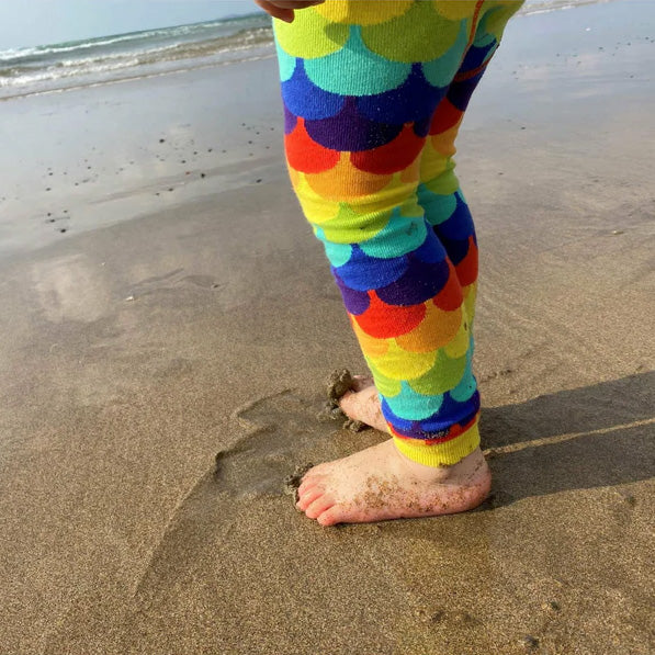 Child wearing Slugs & Snails Organic Footless tights- rainbow scales