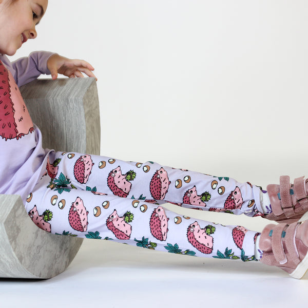 Girl wearing Smafolk organic Leggings- hedgehogs, orchid petal