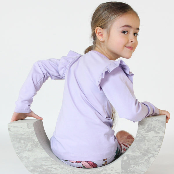 Girl wearing Smafolk organic Long sleeved frill t-shirt- hedgehog, orchid petal