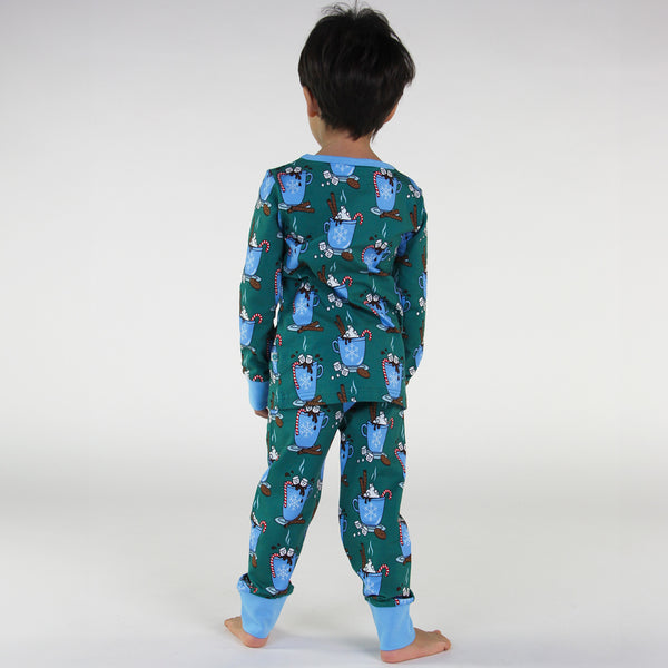 Boy wearing Smafolk organic Pajamas- hot chocolate, petroleum green, back