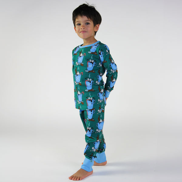 Boy wearing Smafolk organic Pajamas- hot chocolate, petroleum green