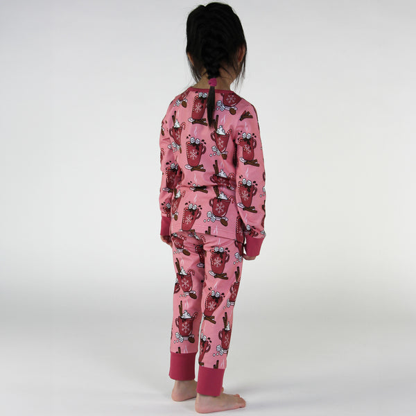 Girl wearing Smafolk organic Pajamas- hot chocolate, pink