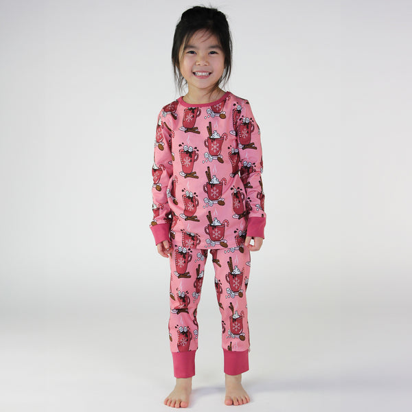 Girl wearing Smafolk organic Pajamas- hot chocolate, pink