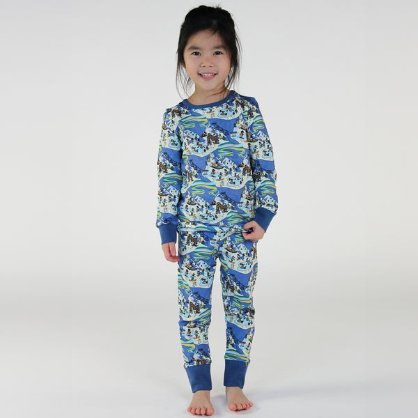 Girl wearing Smafolk organic Pajamas- winter landscape