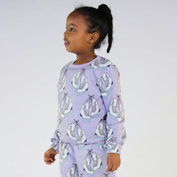 Girl wearing Smafolk organic Sweatshirt- ice skates, orchid purple