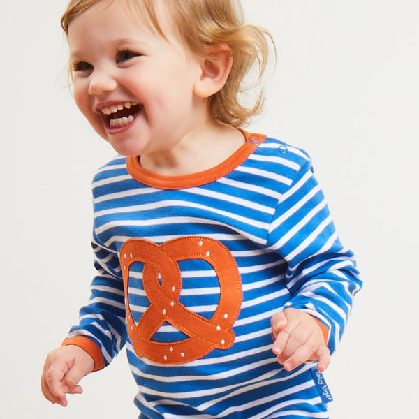 Baby wearing Toby Tiger organic Long sleeve t-shirt- pretzel appliqué