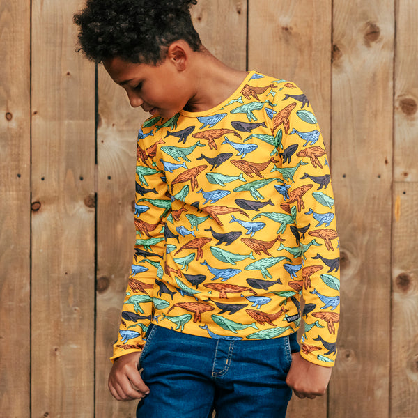 Boy wearing Villervalla organic Long sleeve top- whales, turmeric