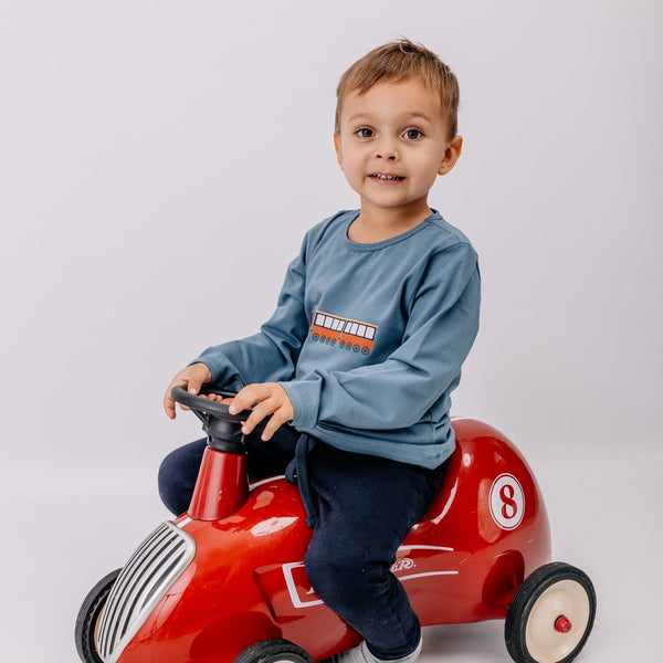 Boy wearing Walkiddy organic Long sleeve shirt- tiny trains