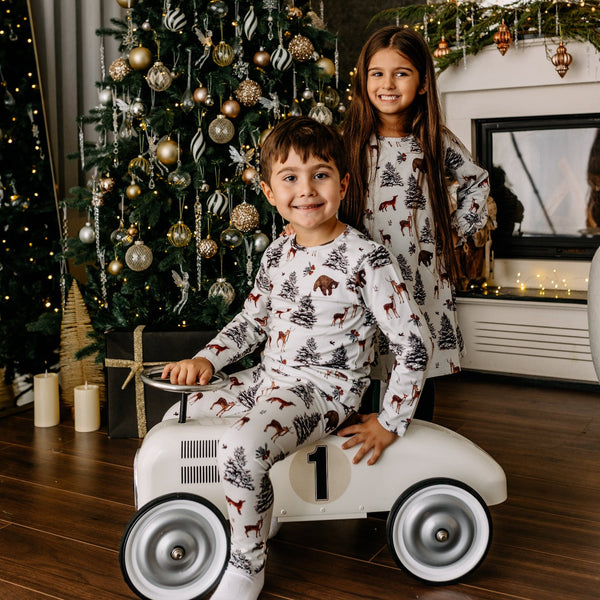 Boy wearing Walkiddy organic Long sleeve shirt- winter woodland