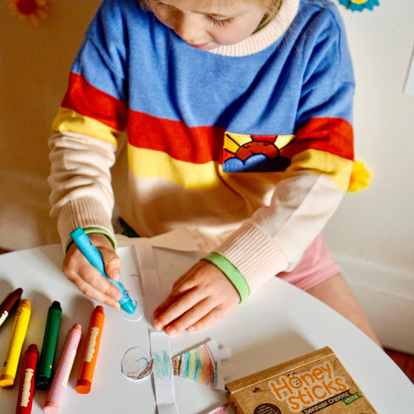 Girl using Honeysticks Jumbos beeswax crayons