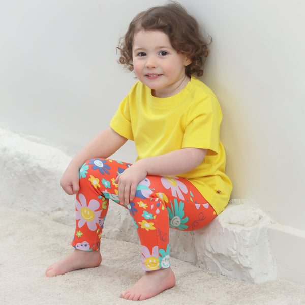 Girl wearing Piccalilly organic Pants- flower power