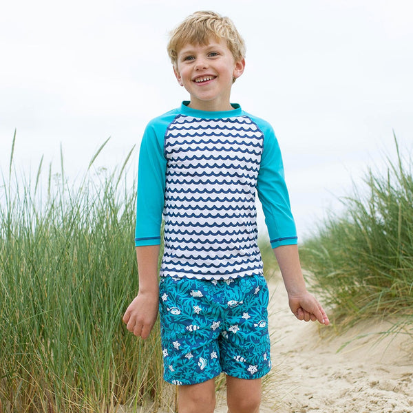 Boy wearing Kite Clothing Coral reef swim shorts