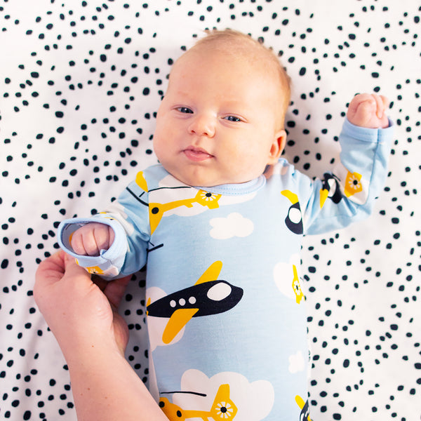 Baby wearing PaaPii light blue propeller long sleeve bodysuit