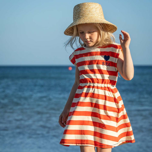 Girl wearing Alba of Denmark Gone surfing dress- spicy love stripes