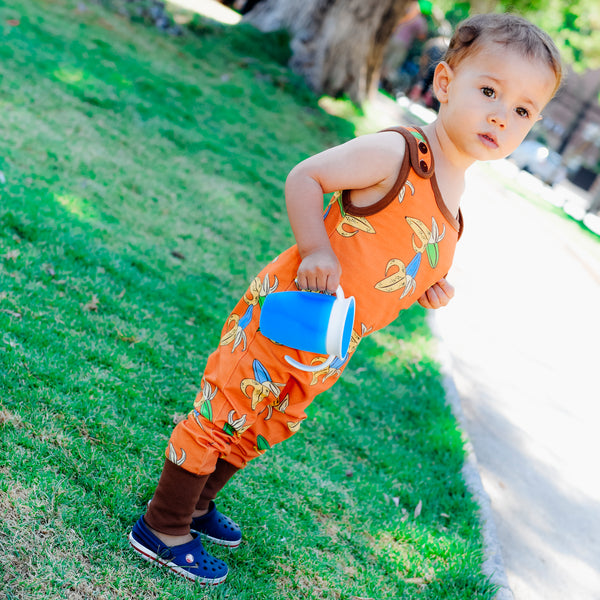 Boy wearing Moromini crazy banana playsuit