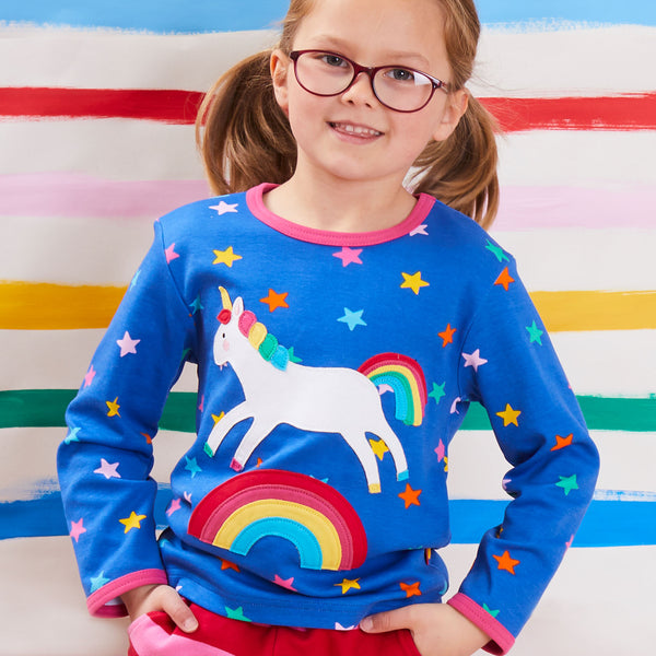 Girl wearing Toby Tiger rainbow unicorn appliqué long sleeve t-shirt