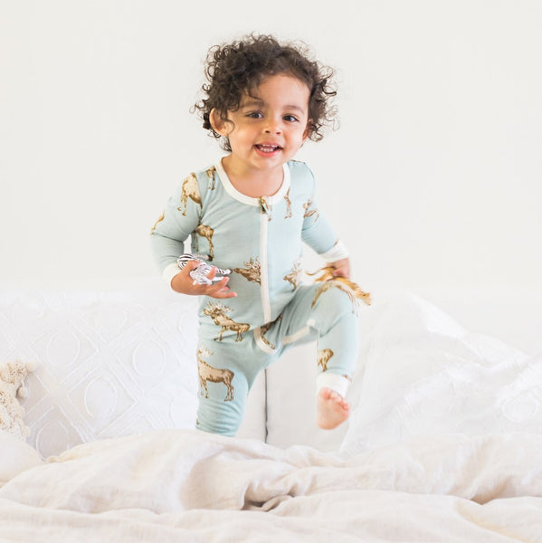 Baby wearing Milkbarn's zipper pajamas