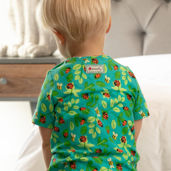 Baby wearing Piccalilly all over print ladybug t-shirt, back