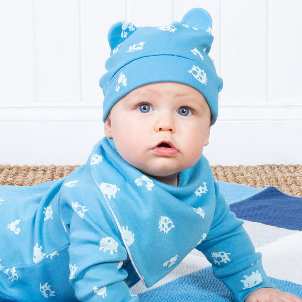 Baby wearing Kite blue polka farm hat
