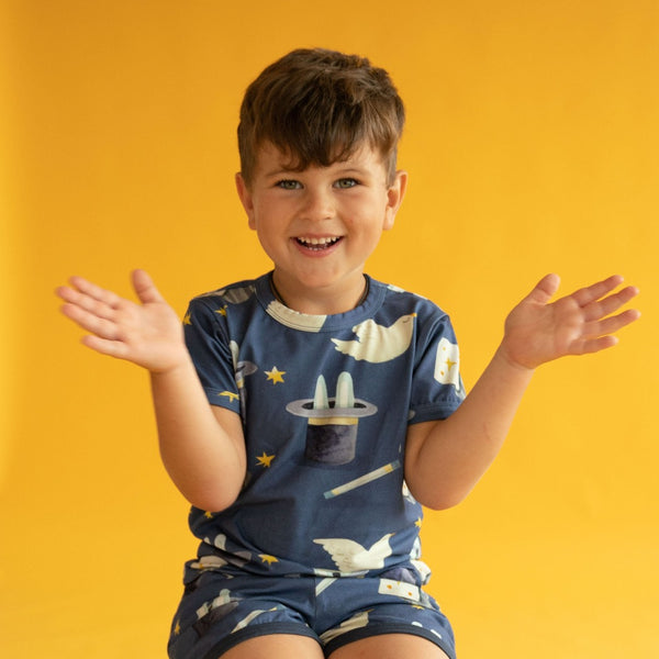 Boy wearing Curious Stories organic Short sleeve shirt- magic