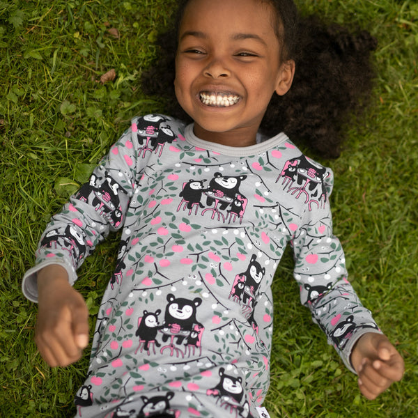 Girl wearing PaaPii organic Vieno long sleeve tunic- gray & pink garden party