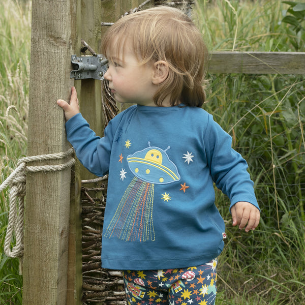 Girl wearing Piccalilly organic Long sleeve top- alien