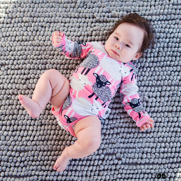 Baby wearing PaaPii light pink baa long sleeve bodysuit