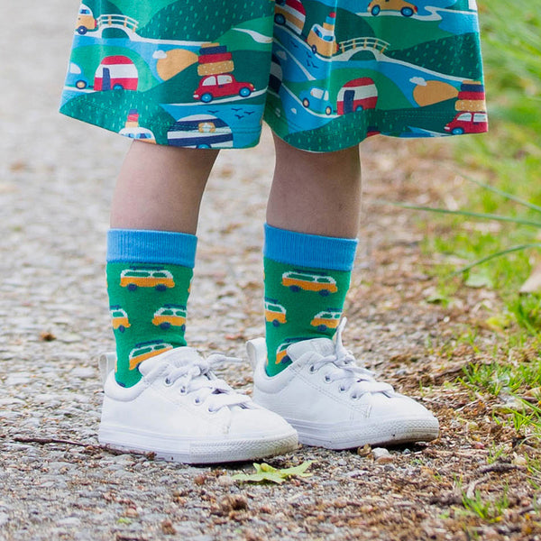 Girl wearing Kite Clothing organic Dinosaur socks