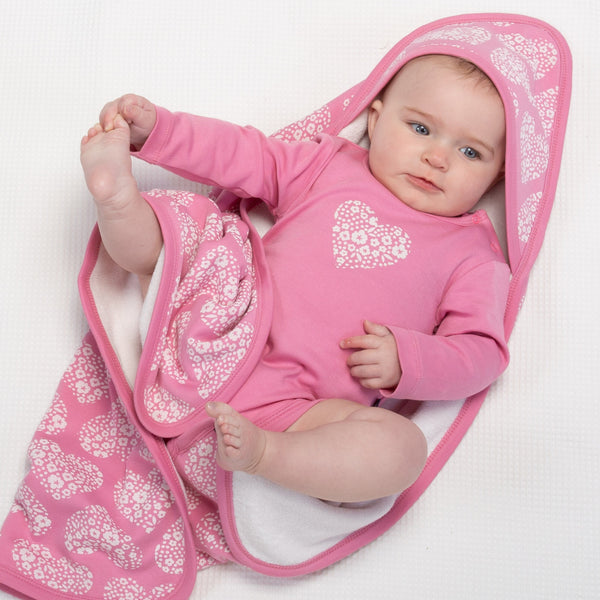 Baby wearing Kite ditsy heart cuddle wrap