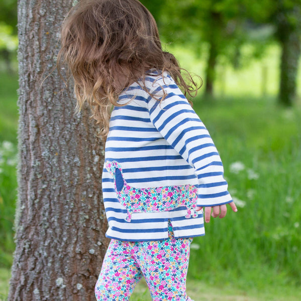 Girl wearing Kite Clothing organic Dachshund stripe top