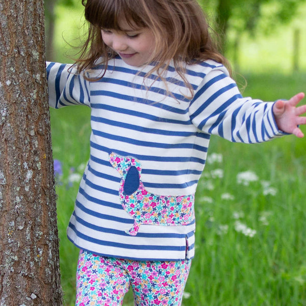Girl wearing Kite Clothing organic Dachshund stripe top