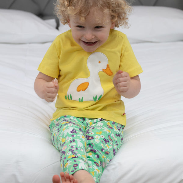 Boy wearing Piccalilly Leggings- spring meadow