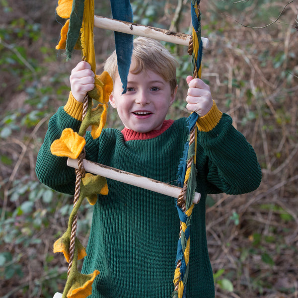 Boy wearing Little Green Radicals organic Olive knit sweater