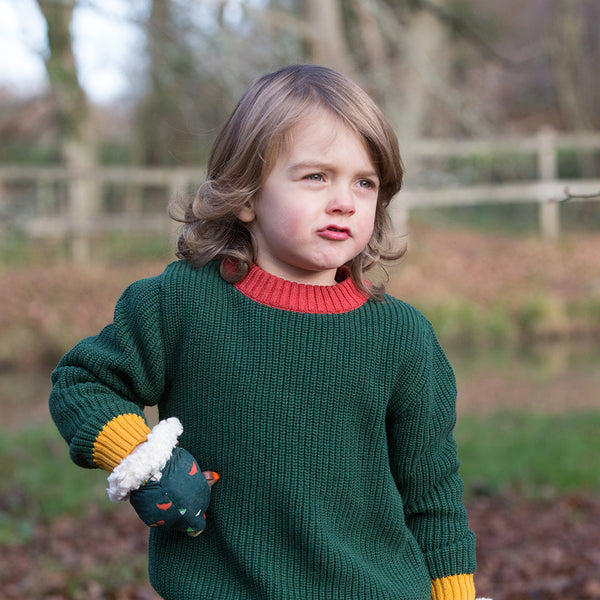 Child wearing Little Green Radicals organic Olive knit sweater