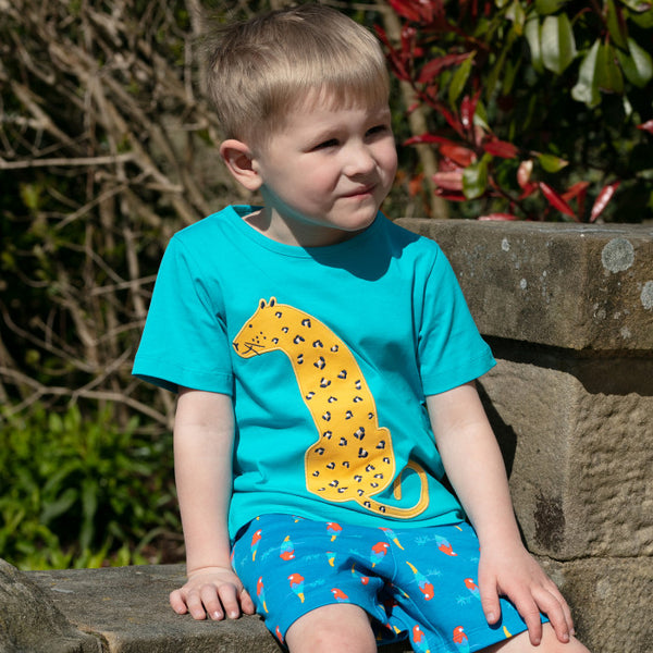 Boy wearing Piccalilly organic Short sleeve top- leopard appliqué