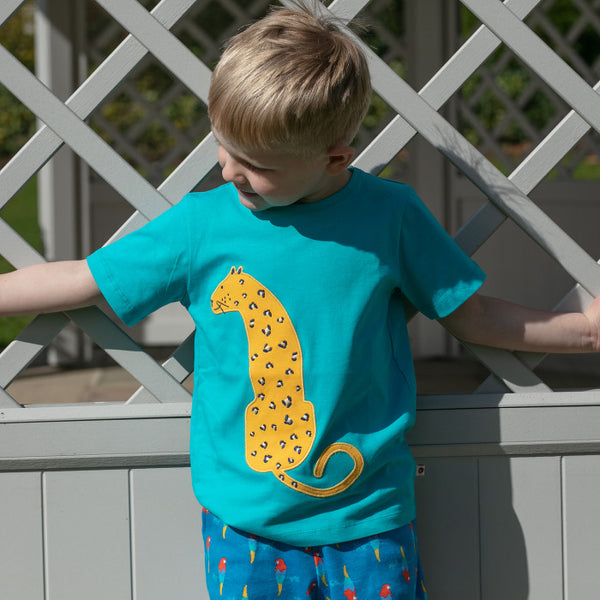Boy wearing Piccalilly organic Short sleeve top- leopard appliqué