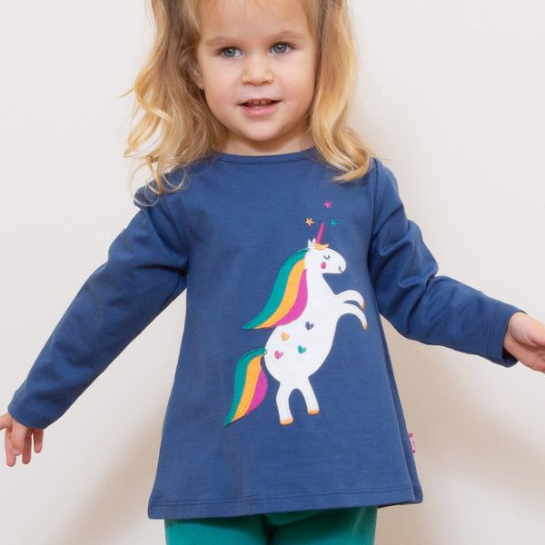 Girl wearing Magical unicorn tunic