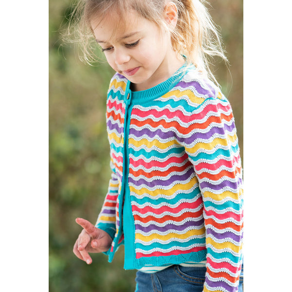 Girl wearing Frugi Rainbow pointelle cardigan