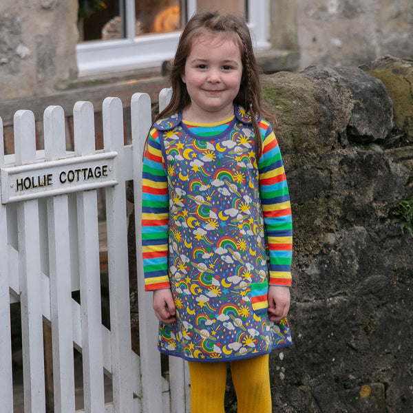 Girl wearing Piccalilly Long sleeve top- rainbow stripe
