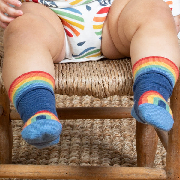 Baby wearing Kite rainbow socks fall