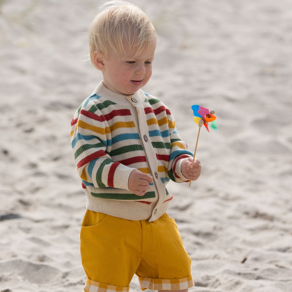 Baby wearing Little Green Radicals organic Rainbow striped knit cardigan