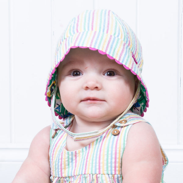 Baby wearing Kite seersucker sun hat