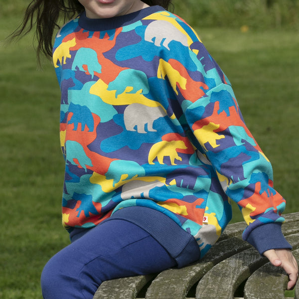 Girl wearing Piccalilly organic Sweatshirt- camo bear