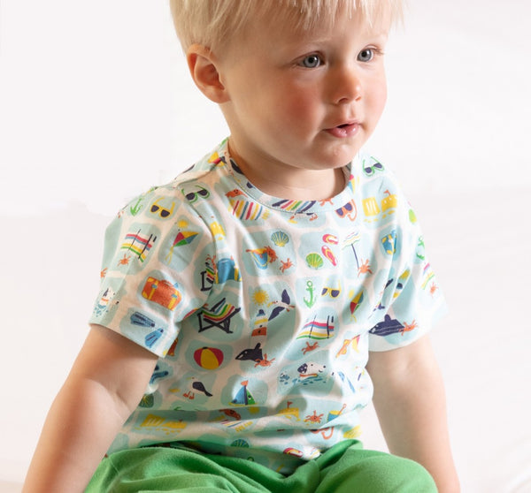 Boy wearing Piccalilly all over print seaside t-shirt